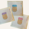 A needlepoint canvas featuring a sourdough starter pattern. The pattern showcases a jar filled with tan sourdough starter, an orange rubber band and options for a blue, pink or purple lid cover. The canvas features a color palette panel and is signed by "Eloise."