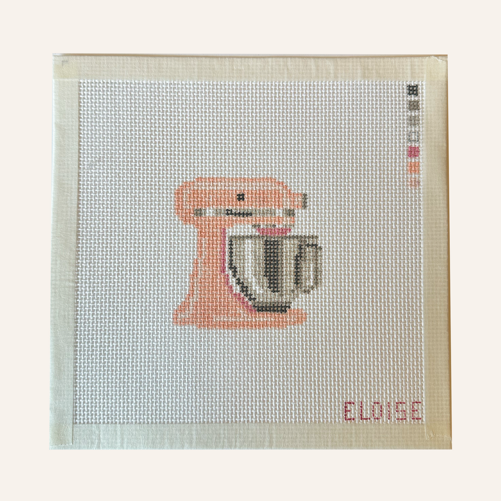 needlepoint canvases featuring a stand mixer pattern in pink. The canvases feature a color palette panel and is signed by "Eloise."