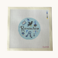 A Ravenclaw needlepoint canvas designed as a red circle with Ravenclaw motifs. the canvas has a color palette guide and is signed "Eloise"